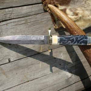 FOSSIL CORAL AND WARTHOG HANDLE DAMASCUS DAGGER