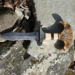 JURASSIC HANDLE DAMASCUS PUSH DAGGER WITH MAMMOTH IVORY, BALTIC AMBER, MASTODON IVORY AND MAMMOTH TOOTH HANDLE WITH FILE WORK.