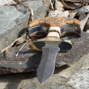 JURASSIC HANDLE DAMASCUS PUSH DAGGER WITH MAMMOTH IVORY, BALTIC AMBER, MASTODON IVORY AND MAMMOTH TOOTH HANDLE WITH FILE WORK.