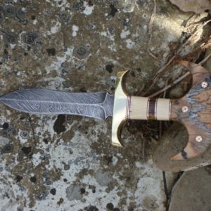 JURASSIC HANDLE DAMASCUS PUSH DAGGER WITH MAMMOTH IVORY, BALTIC AMBER, MASTODON IVORY AND MAMMOTH TOOTH HANDLE WITH FILE WORK.