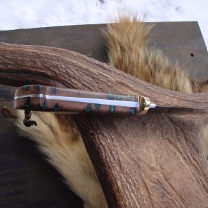 Loveless style tapered tang drop point with emerald green filled banksia pod handle