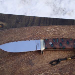 Loveless style tapered tang drop point with emerald green filled banksia pod handle